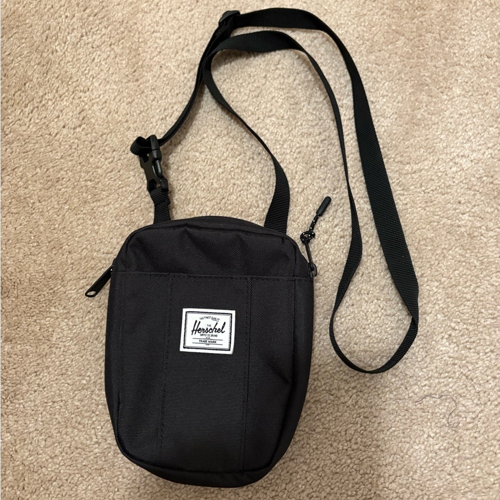 Unisex Herschel Supply Company Black Bag with adjustable strap.